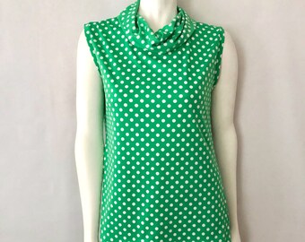 green and white polka dot blouse