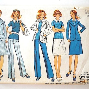May include: Vintage Simplicity sewing pattern featuring five fashion illustrations. The designs include suits, pantsuits, and skirts in shades of blue, white, and a touch of red. The pattern is sized for a bust of 36 inches and size 14. The text on the pattern reads "Top Sized for Stretch Knit Only."
