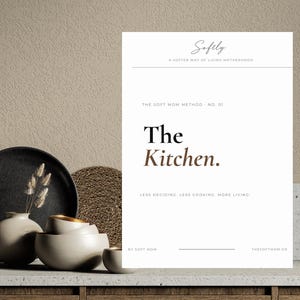 May include: A white rectangular print featuring the text Softly, A Softer Way of Living Motherhood, The Soft Mom Method No. 01, The Kitchen, Less Deciding, Less Cooking, More Living, By Soft Mom, and thesoftmom.co in black and brown fonts.