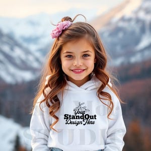May include: A white hoodie with a black design that says "Your StandOut Design Here" with a small floral graphic above the text. A young person is wearing the hoodie and smiling at the camera.