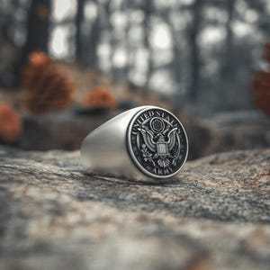 Handcrafted soldier honor ring with eagle shield emblem on smooth silver band