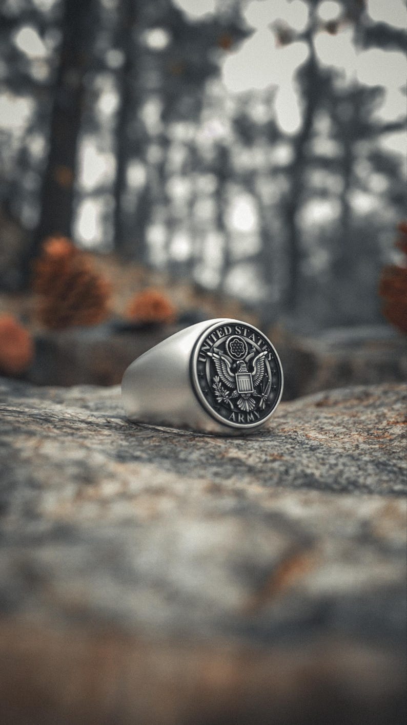 Handcrafted soldier honor ring with eagle shield emblem on smooth silver band
