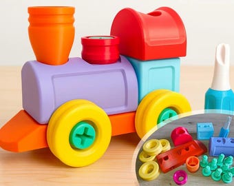 May include: A colorful toy train constructed from modular plastic pieces in shades of orange, purple, red, light blue, and yellow, featuring a screwdriver tool. An inset circle displays additional disassembled components including wheels, screws, and blocks.