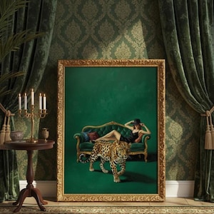 May include: A framed artwork depicts a woman in a black dress and hat reclining on a green sofa, with a leopard walking in front. The artwork is set against a green backdrop and framed in gold. A side table with a candelabra and candles is on the left.