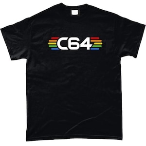 May include: Black t-shirt with the text "C64" in white, accompanied by rainbow-coloured stripes above and below. The shirt is made of a soft material.