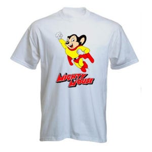 May include: White t-shirt featuring a cartoon image of Mighty Mouse in a flying pose. The character is wearing a yellow shirt, red cape, and red shorts. The words "Mighty Mouse" are printed in red and blue below the character.