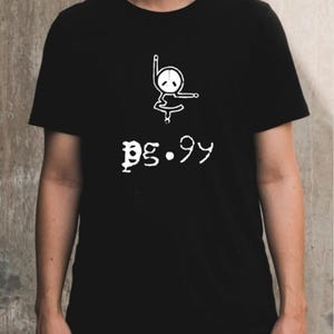 May include: Black t-shirt featuring a white graphic of a ballet-style figure and the text "pg.99". The design is minimalist, suitable for everyday wear. The t-shirt is a versatile piece.
