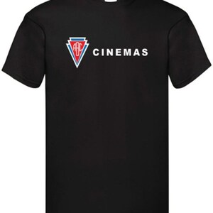 May include: Black t-shirt with the white text "ABC CINEMAS". The logo is a red, white, and blue triangle. The shirt is made of a soft material and has short sleeves.