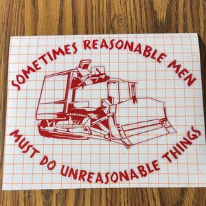 May include: A red decal featuring a bulldozer illustration with the text "Sometimes Reasonable Men Must Do Unreasonable Things" in a curved font. The decal is on a white background with a grid pattern.