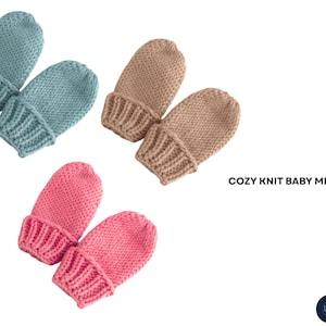 May include: Three pairs of cosy knit baby mittens in light blue, beige, and pink. Each pair has a ribbed cuff and a soft, textured knit. The text "COZY KNIT BABY MITTENS" is displayed in black.