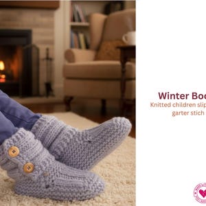 May include: Light gray knitted children's slippers with two wooden buttons. The slippers are in garter stitch and are designed to keep feet warm. The text "Winter Boots" is visible in the image.
