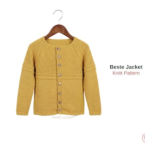May include: Mustard yellow knitted jacket with a textured yoke and long sleeves, hanging on a wooden hanger. The jacket has wooden buttons down the front. Text on the right says "Beste Jacket Knitt Pattern".