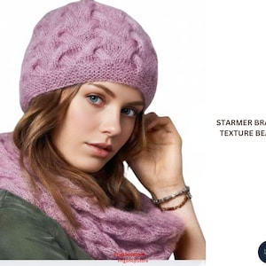 May include: A woman wearing a light purple braided texture beanie and matching scarf. The beanie and scarf are made of a soft, knitted material. The text "STARMER BRAIDED TEXTURE BEANIE" is visible in the image.