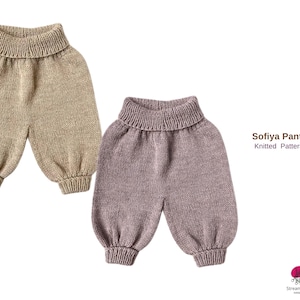 May include: Two pairs of knitted baby pants in beige and mauve. The pants have a high, ribbed waistband and ribbed cuffs at the ankles. The text "Sofiya Pants Knitted Pattern" is visible on the right side of the image.