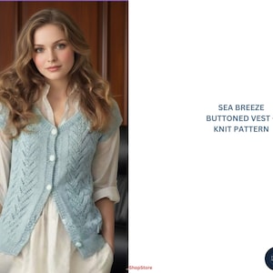 May include: A light blue, buttoned knit vest with a leaf pattern. The vest is sleeveless and has a V-neck. The text "SEA BREEZE BUTTONED VEST - KNIT PATTERN" is displayed on the right side of the image. The vest is worn over a white blouse.