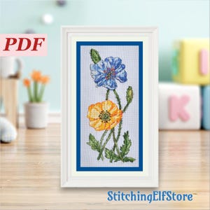 Kruissteekpatroon betoverde klaprozen. Leuke bloemrijke borduurkaart. Blauwe en gele bloemen, lente, zomer. Ontwerp deurhanger