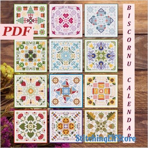May include: A set of 12 cross-stitch patterns for a biscornu calendar. Each square pattern features a different design, including hearts, flowers, and geometric shapes. The patterns are in a variety of colors, including red, blue, green, yellow, and white.