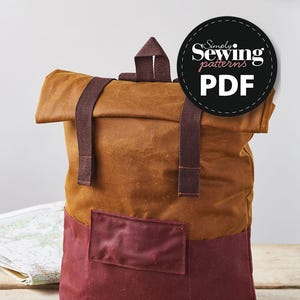 May include: A brown and burgundy canvas backpack with a roll-top closure and two adjustable straps. The backpack has a front pocket and the text "Simply Sewing patterns PDF" is on a black circle.