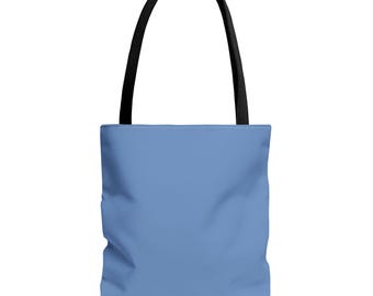 Puede incluir: Una bolsa de tela azul lisa con asas negras.