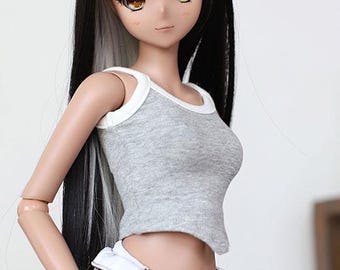 May include: A gray tank top with white trim, worn by a doll with long black and white hair.