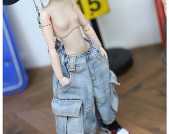 May include: A doll with a pale complexion wearing light blue denim cargo pants with an elastic waistband and side pockets, paired with high-top sneakers featuring white, black, red, and blue color blocking. The text reads COPYRIGHTS (C) 2025 TTYA.COM.
