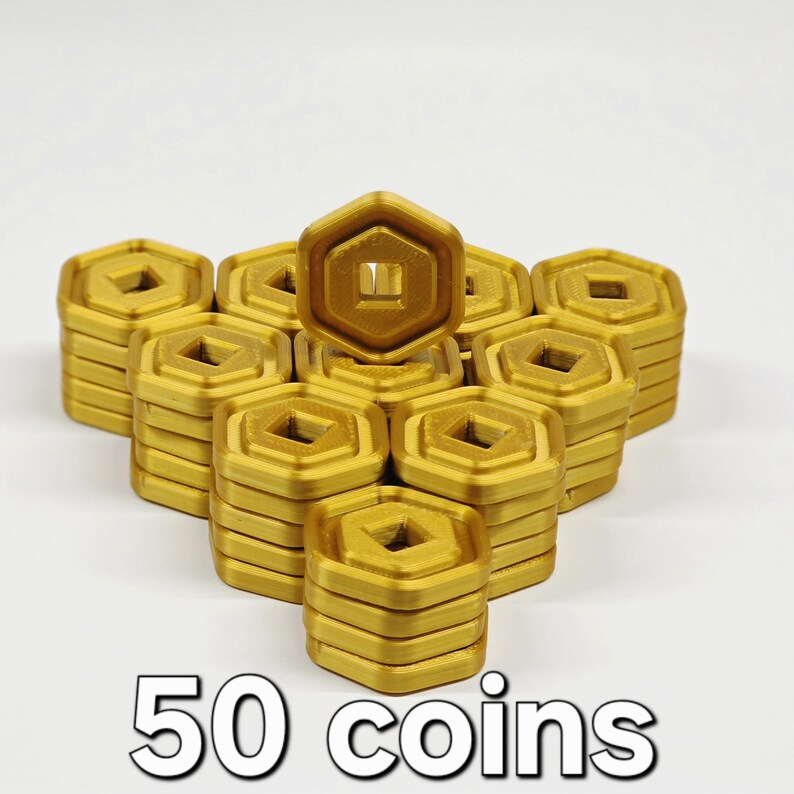May include: A collection of gold-colored, hexagonal coins stacked in neat piles. Each coin features a square cutout in the center. The text "50 coins" is displayed at the bottom of the image.