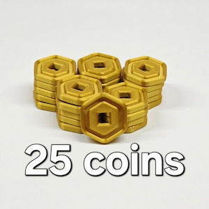 May include: A collection of gold-colored, hexagonal coins with a square center hole. The coins are stacked in several piles. The text "25 coins" is displayed in a white, bold font at the bottom of the image.