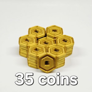 May include: A collection of 35 gold-colored, hexagonal coins. Each coin has a square center and is stacked in small piles. The text "35 coins" is displayed in a white font at the bottom of the image.