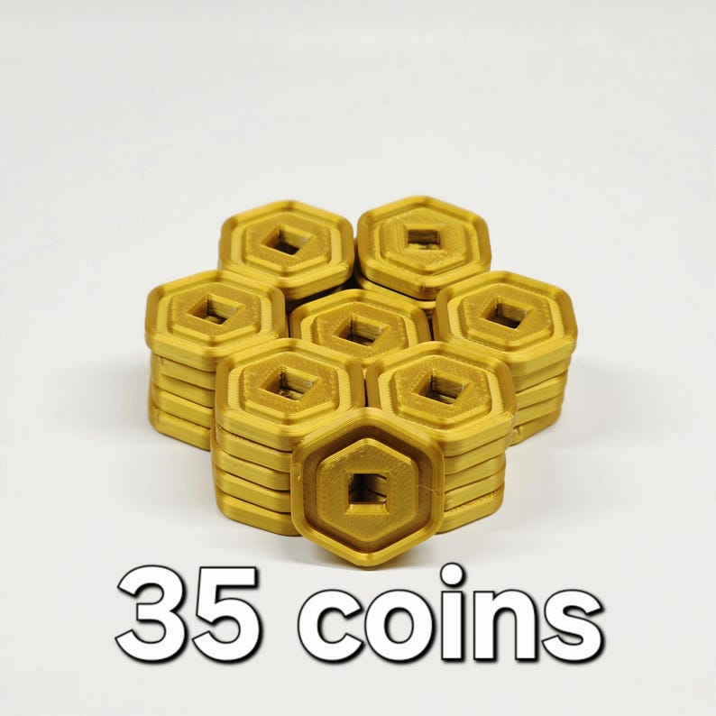 May include: A collection of 35 gold-colored, hexagonal coins. Each coin has a square center and is stacked in small piles. The text "35 coins" is displayed in a white font at the bottom of the image.