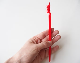 Red Hair Ornament With Twirly Twisted Design