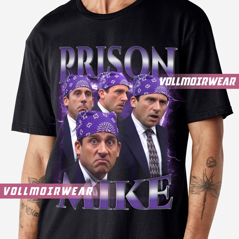 May include: Black t-shirt featuring a graphic design with the word "PRISON" above a collage of four images of a man wearing a purple bandana. The word "MIKE" is below the images, with the text "VOLLMOIRWEAR" on the shirt.