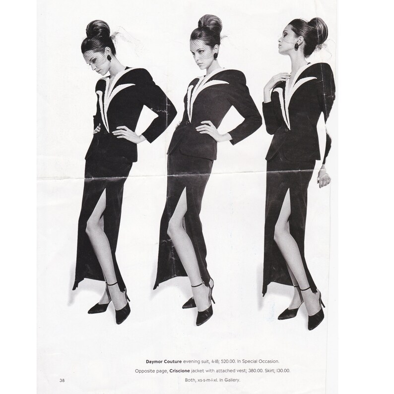 May include: Three black and white photos of a woman wearing a black suit with a white trim. The suit has a long skirt with a slit up the side. The woman is wearing a black hat and has her hair pulled back. The text on the page reads "Daymor Couture evening suit, 418; 520.00. In Special Occasion. Opposite page, Criscione jacket with attached vest; 380.00, Skirt; 130.00. Both, xs-s-mixt. In Gallery."