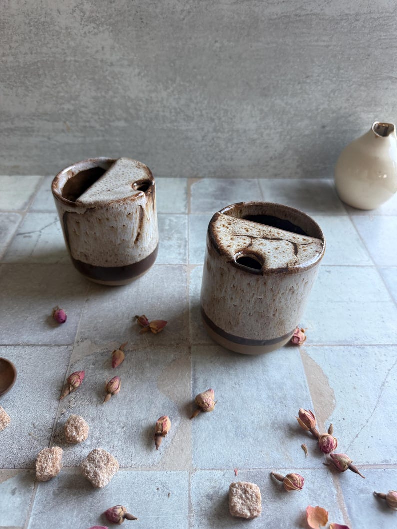 Side profile of pottery to-go mug with speckled beige and brown toasted accents, handmade for outdoor use, holidays, or 9th anniversary pottery gifting