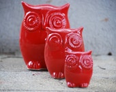Owl family of three in red