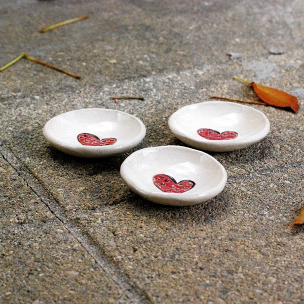 three tiny red heart ring bowls