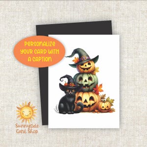 May include: Halloween greeting card featuring a stack of carved pumpkins wearing witch hats, a black cat, and autumn leaves. The card has the text "Personalize your card with a caption" and the logo for Sunnyside Card Shop.