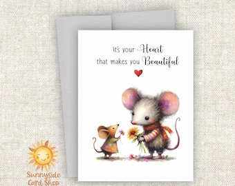 May include: Greeting card with a watercolor illustration of two mice. One mouse offers flowers to the other. The card reads "It's your Heart that makes you Beautiful" with a red heart. The Sunnyside Card Shop logo is in the corner.