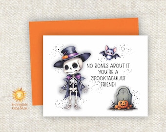 May include: A Halloween-themed greeting card featuring a cartoon skeleton wearing a hat and cape, with a bat and pumpkin. The card reads "No bones about it you're a spooktacular friend!" An orange envelope is behind the card.