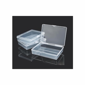 May include: Three clear plastic storage boxes with lids. The boxes are stacked on top of each other. The top box is open.
