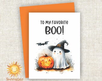 May include: Halloween greeting card with a watercolor illustration of a friendly ghost wearing a witch hat, a carved pumpkin, and a bat. The card reads "TO MY FAVORITE BOO!" and is paired with an orange envelope.