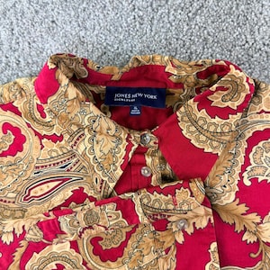 May include: A set of three ceramic mugs with a speckled, matte finish. The mugs are in shades of cream, light gray, and dark gray. Each mug has a simple, minimalist design and a rounded handle. Perfect for coffee or tea.