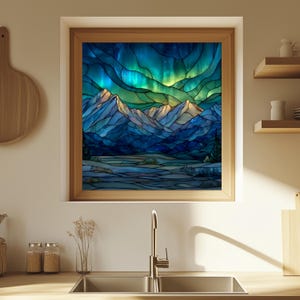 May include: A framed stained glass artwork depicting a mountain landscape under a vibrant aurora borealis. The artwork features shades of blue, green, and yellow, with a wooden frame. The image is displayed in a kitchen setting.