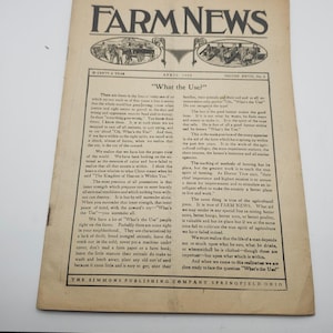 May include: A vintage copy of Farm News magazine from April 1918, featuring the headline "What the Use?" and articles about farming. The cover has illustrations and text, with a cream-colored background.