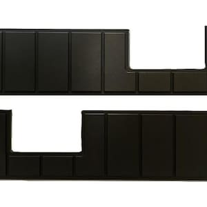 May include: Two rectangular black panels featuring a series of vertical recessed grooves. Each panel has a distinct cutout section on one side, creating an asymmetrical shape with a smooth, matte finish and uniform geometric segments throughout.