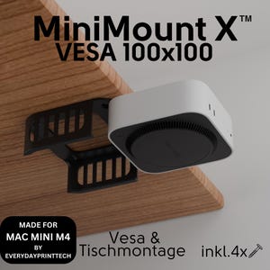 Könnte beinhalten: Eine schwarze Metallhalterung für einen Mac Mini M4 Computer. Die Halterung ist so konzipiert, dass sie an der Unterseite eines Schreibtisches oder Tisches befestigt werden kann. Die Halterung enthält Schrauben für die Installation. Der Text "MiniMount X™ VESA 100x100" ist auf dem Bild zu sehen. Der Text "MADE FOR MAC MINI M4 BY EVERYDAYPRINTTECH" ist ebenfalls auf dem Bild zu sehen. Der Text "Vesa & Tischmontage inkl.4x" ist auf dem Bild zu sehen.