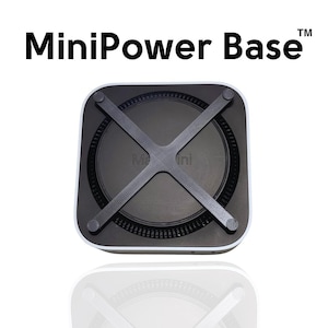 Puede incluir: Una base de alimentación Mini negra con un borde blanco y una estructura de soporte en forma de X negra. La base está diseñada para sostener un Mac Mini.