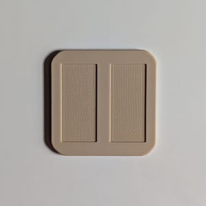 Back of Wall Mount pictured (insets for adhesive strips); two are included in listing.