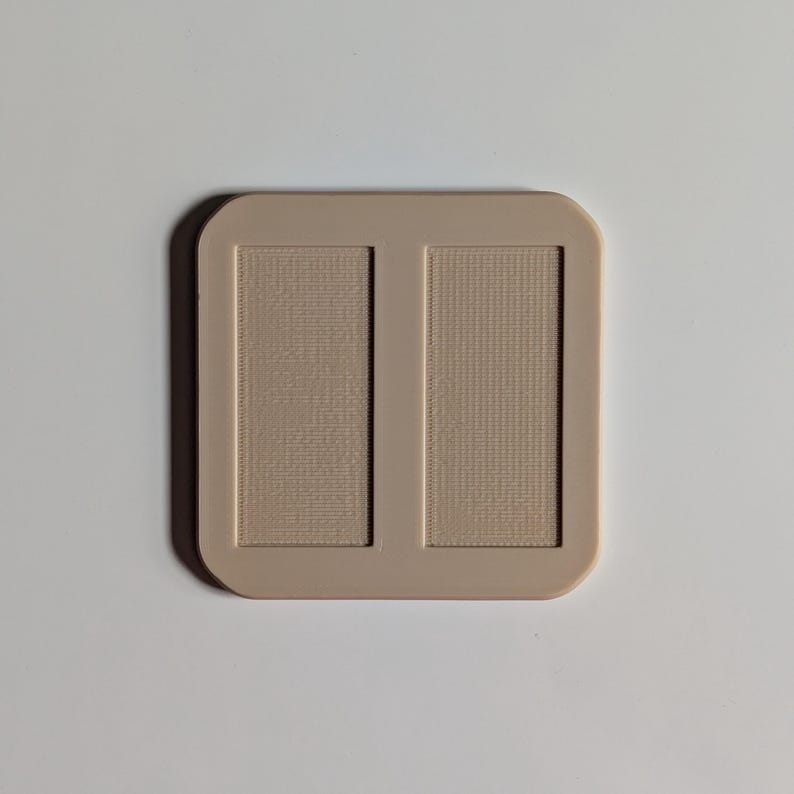 Back of Wall Mount pictured (insets for adhesive strips); two are included in listing.