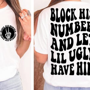 May include: White t-shirt with black text that reads "Block His Number And Let Lil Ugly Have Him". The text is in a retro font style.