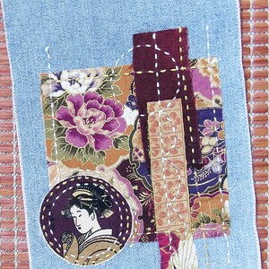 May include: A denim fabric patchwork with a floral design, a burgundy fabric square, and a circular image of a woman with a floral design. The patchwork is stitched together with white thread.